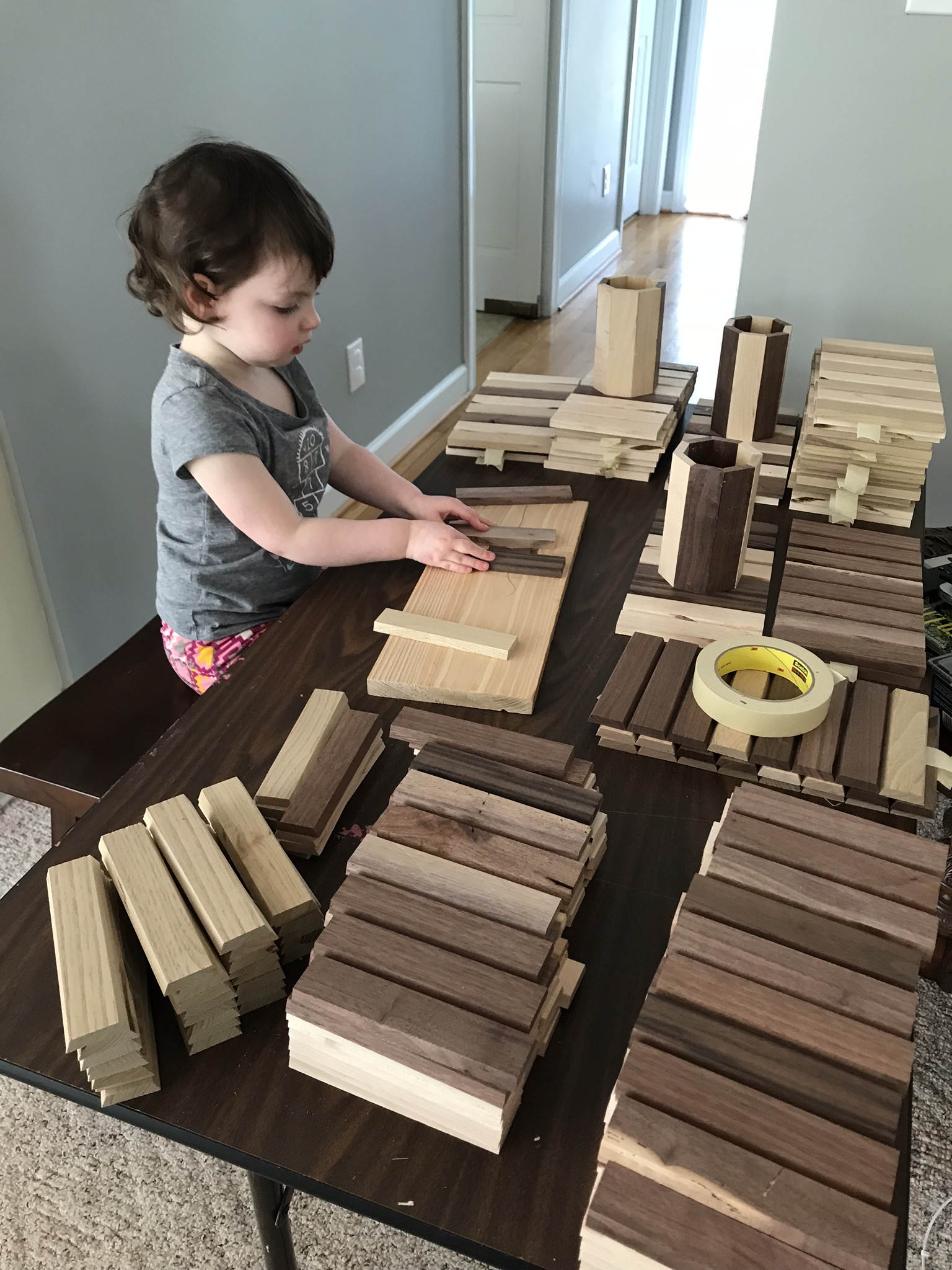 Daughter sorting staves, age 2